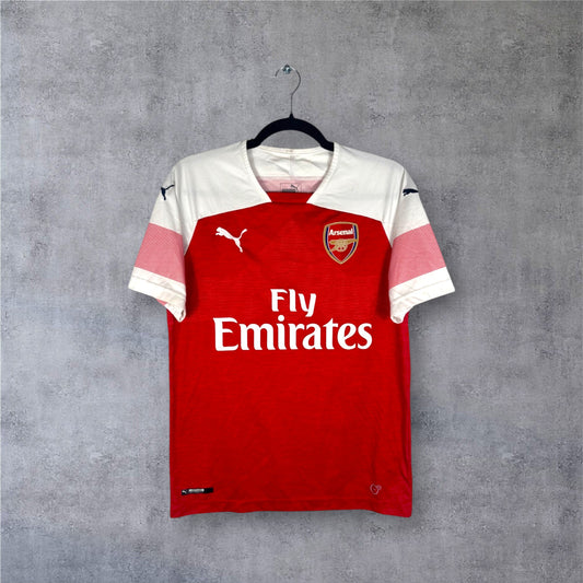 Vue de face du maillot Arsenal 2018/19 avec manches blanches à motifs pulsations roses.