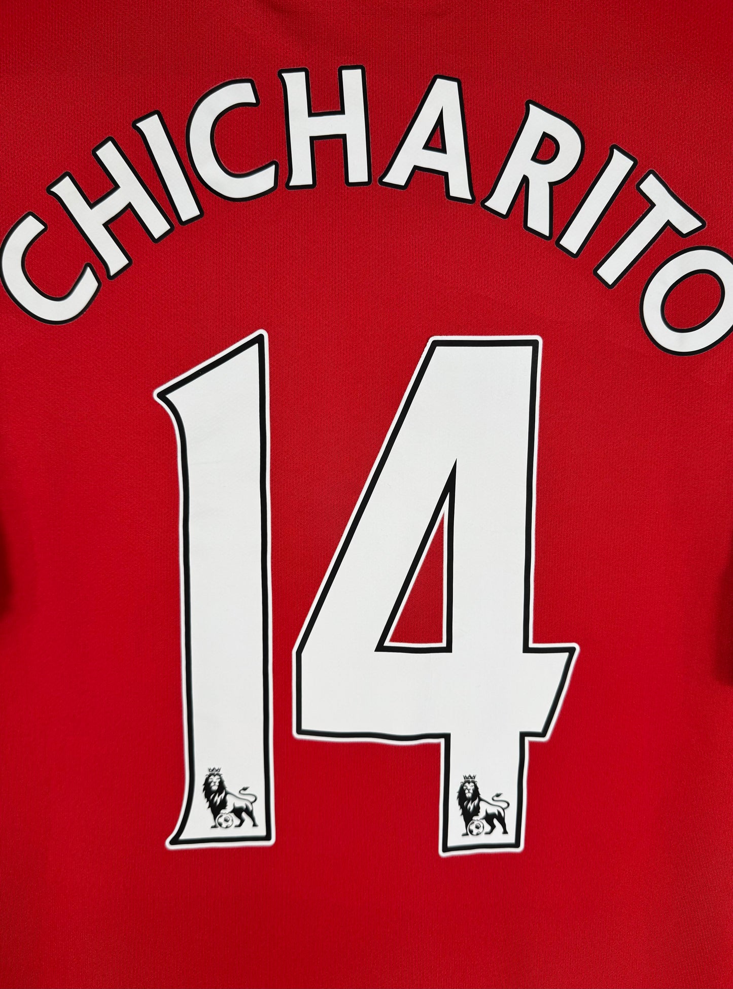 Détail de la typographie du flocage d'origine sur le numéro 14 de Javier Hernández