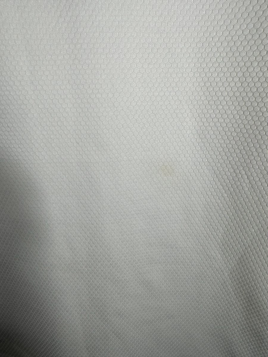 Détail micro tache maillot OL 2020-2021 domicile