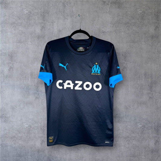 Maillot OM 2022-23 extérieur bleu marine Puma authentique vue de face.