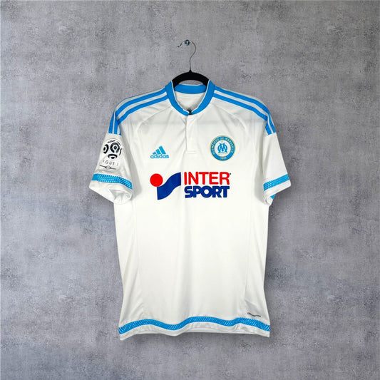 Vue de face du maillot OM 2015/16 blanc col rond bleu avec sponsor Intersport.