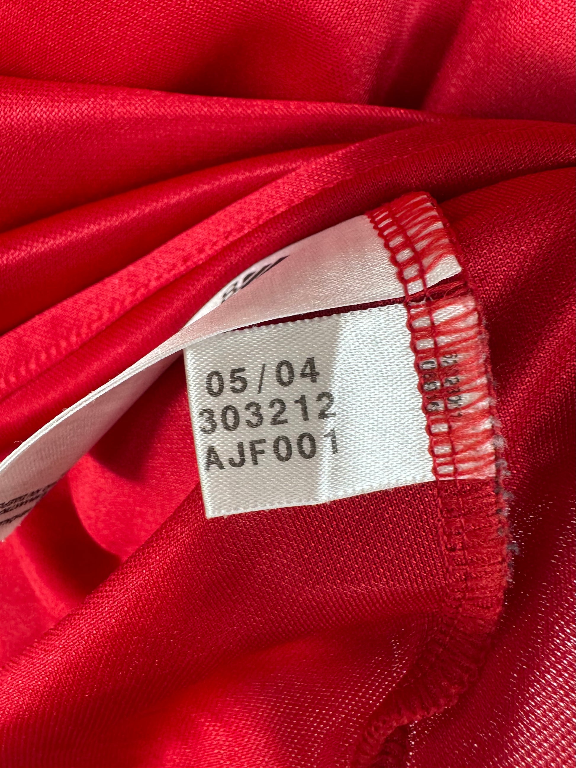 Étiquette interne de production Adidas code 303212 certifiant l'authenticité du maillot.