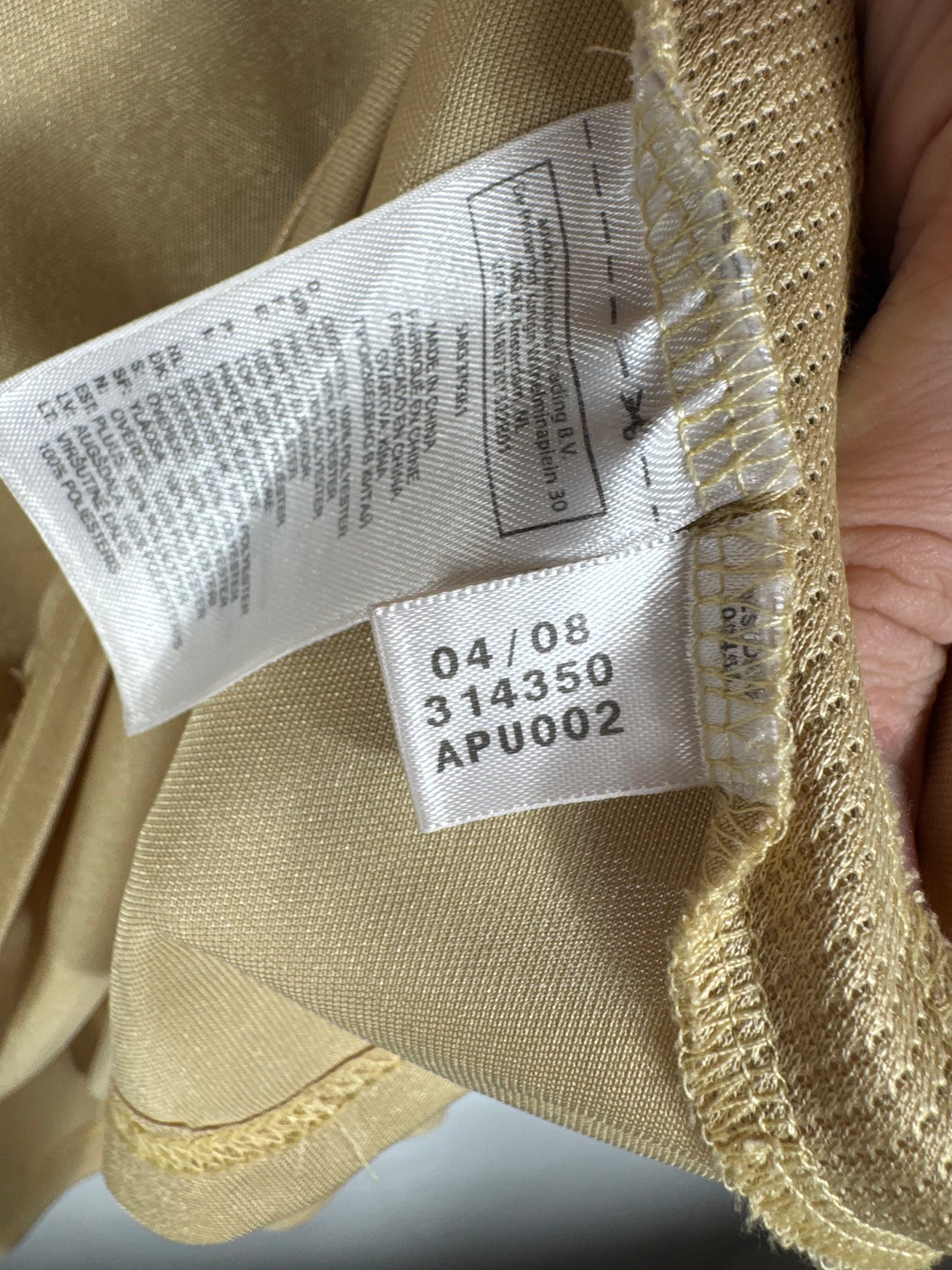 Étiquette interne Adidas code 314350 certifiant l'authenticité du maillot de Taye Taiwo.