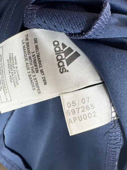 Étiquette interne Adidas code 697265 certifiant l'authenticité du maillot Robinho.