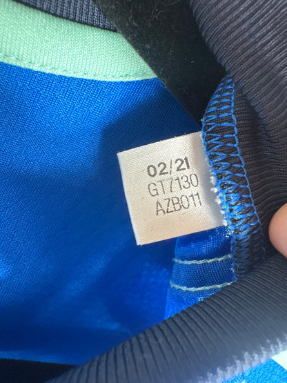 Étiquette interne Adidas code GT7130 certifiant l'authenticité du maillot.