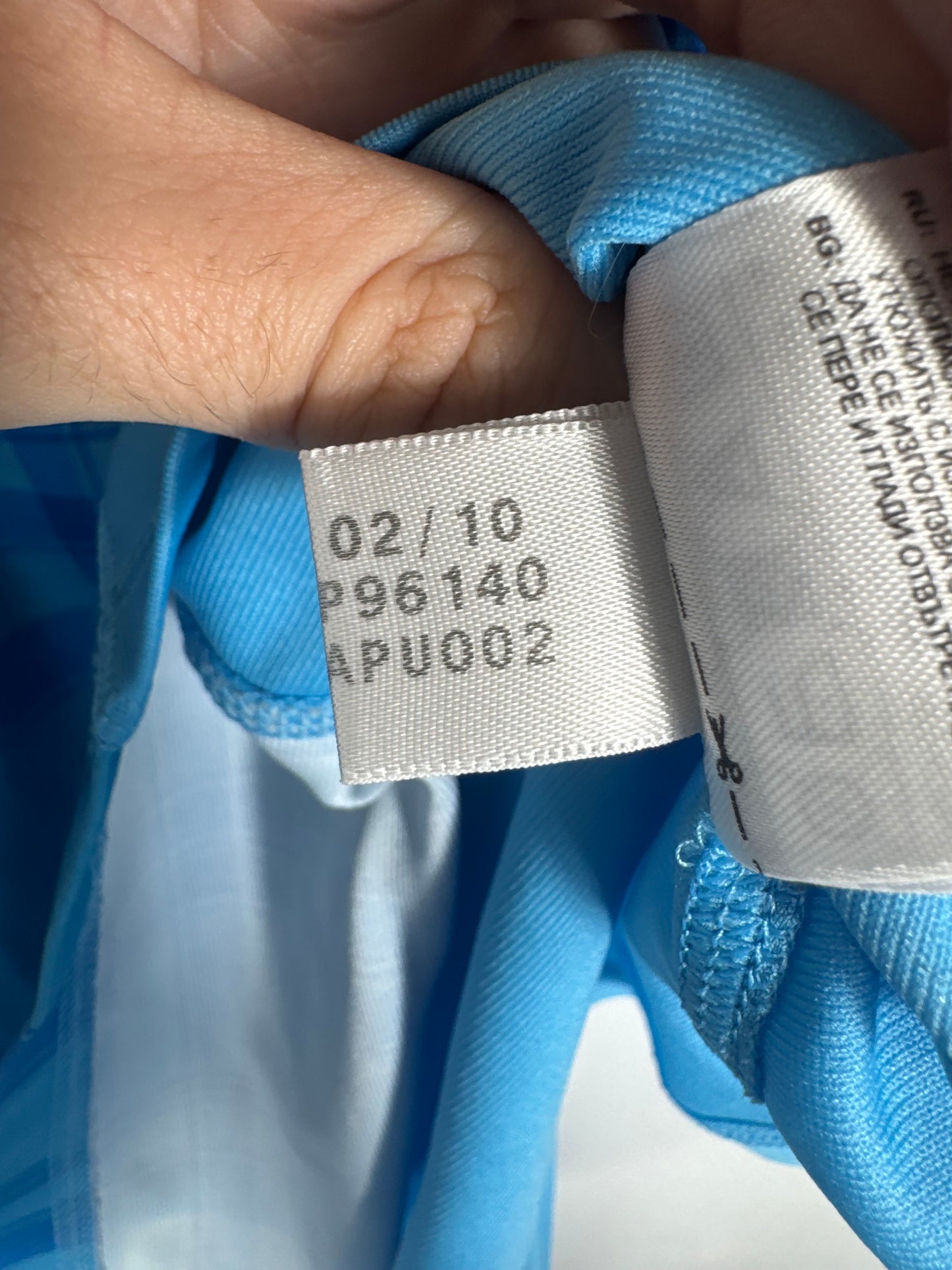 Étiquette interne Adidas code P96140 certifiant l'authenticité du maillot Gignac.