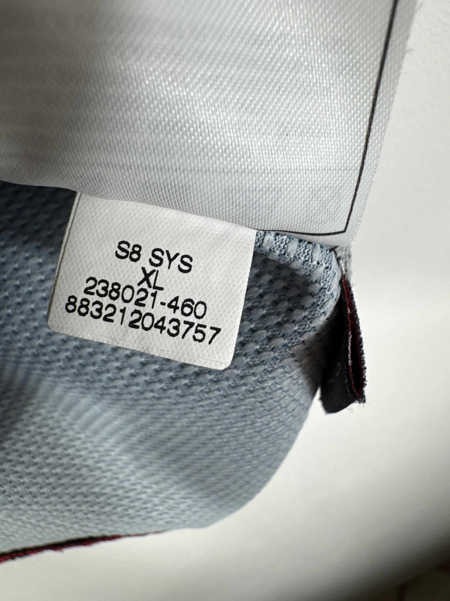 Étiquette interne Nike code 238021-430 certifiant l'authenticité du maillot de Jérôme Rothen, taille XL.