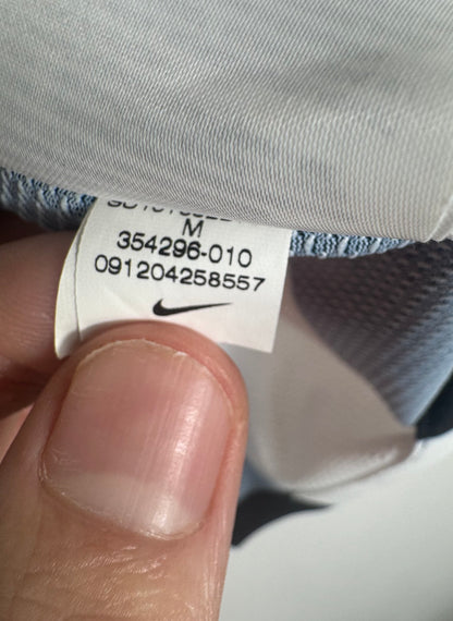 Étiquette interne Nike avec code 354296-010 certifiant l'authenticité du maillot Juve.