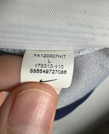 Étiquette interne Nike code 478313-410 certifiant l'authenticité du maillot Messi.