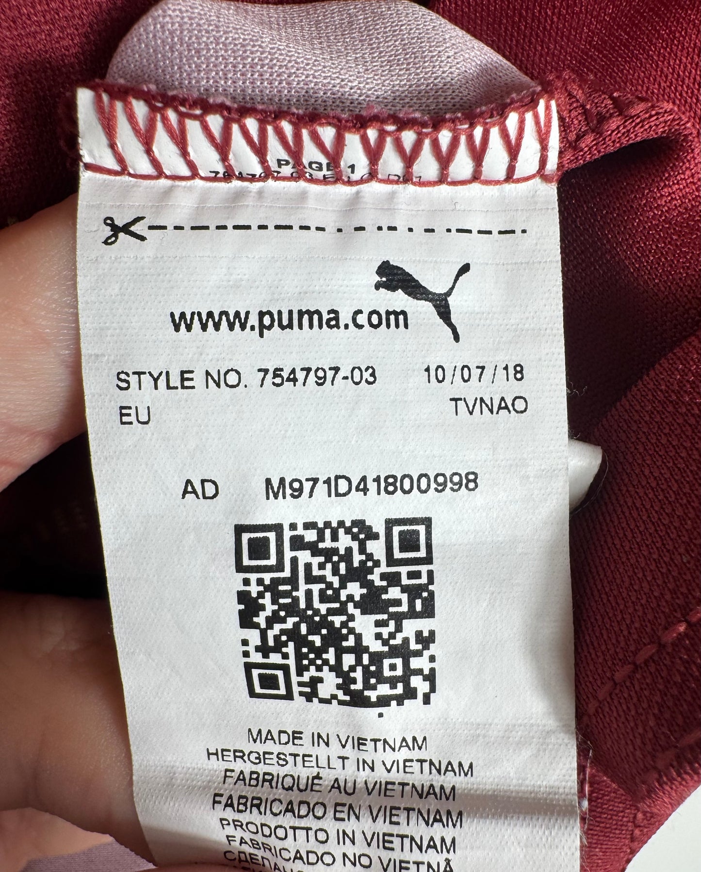 Étiquette interne Puma code 754797-03 certifiant l'authenticité du maillot Reus.