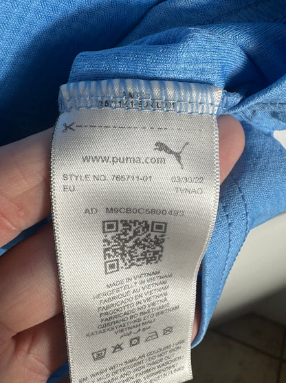 Étiquette interne Puma code 765711-01 certifiant l'authenticité du maillot City.