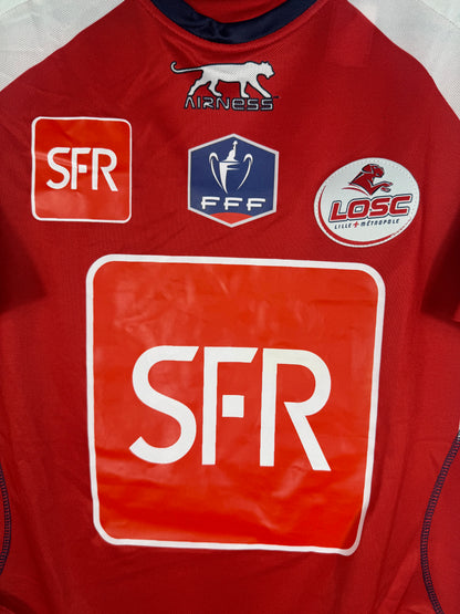 Gros plan sur le badge FFF Coupe de France, le logo LOSC et le sponsor SFR.