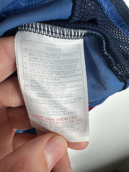 Étiquette interne vintage Nike code S2 AOG certifiant l'authenticité de ce maillot du début des années 2000.