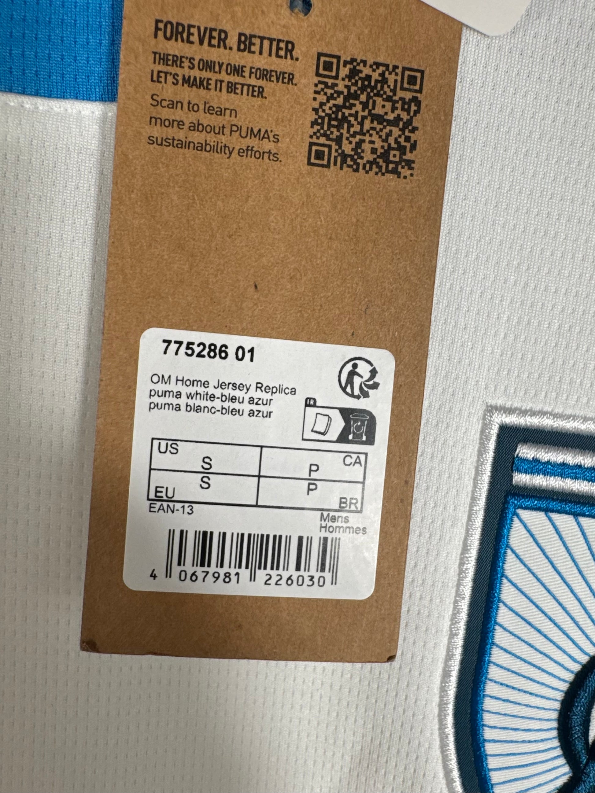 Étiquette cartonnée Puma attachée au col certifiant l'état neuf du produit.