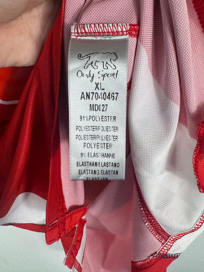 Étiquette interne Airness taille XL certifiant l'origine du maillot.