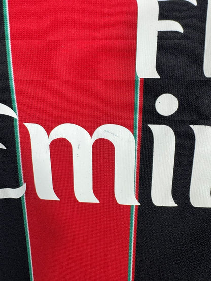 Défaut du maillot AC Milan 2012-2013 : légère usure du sponsor Fly Emirates d'origine