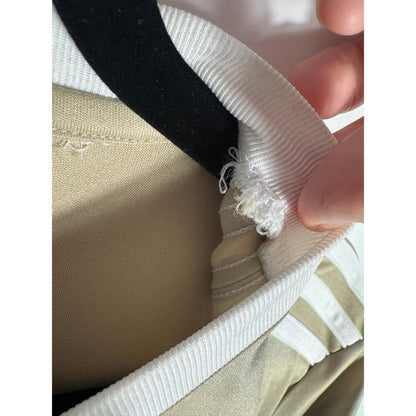 Etiquette d'authenticité Adidas coupée prouvant l'originalité du maillot Ajax