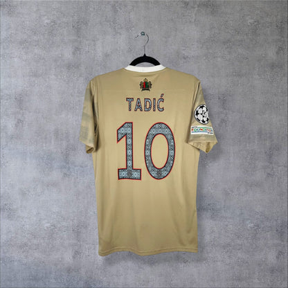 Maillot Ajax Amsterdam 2022-2023 third Daily Paper beige, dos floqué Tadić 10 et patchs Ligue des champions