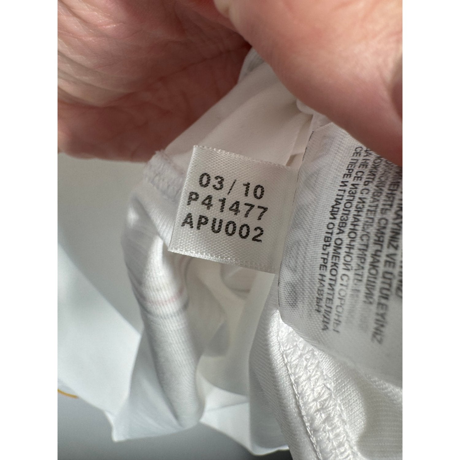 Étiquette d'authenticité avec code Adidas P41477 prouvant l'originalité du maillot