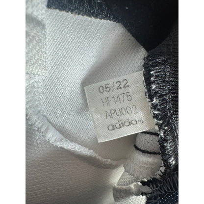 Étiquette d'authenticité avec code Adidas HF1475 prouvant l'originalité du maillot
