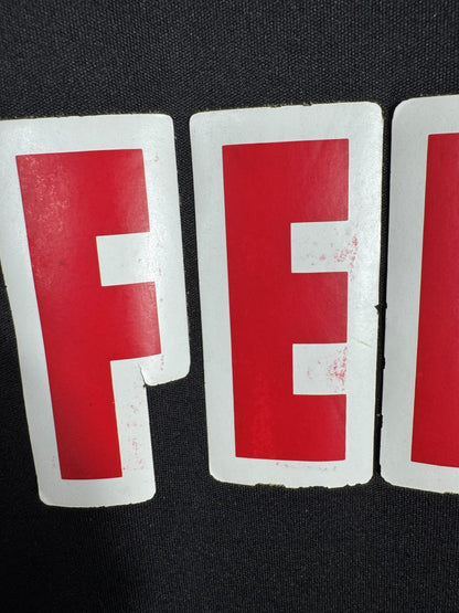 Usure et craquelures du sponsor Fedcom sur le maillot AS Monaco 2013-2014, défaut signalé