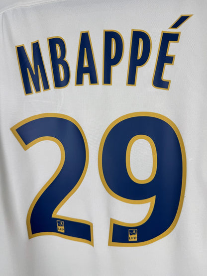 Détail flocage Mbappé 29 bleu bordé jaune, maillot AS Monaco extérieur 2016-2017