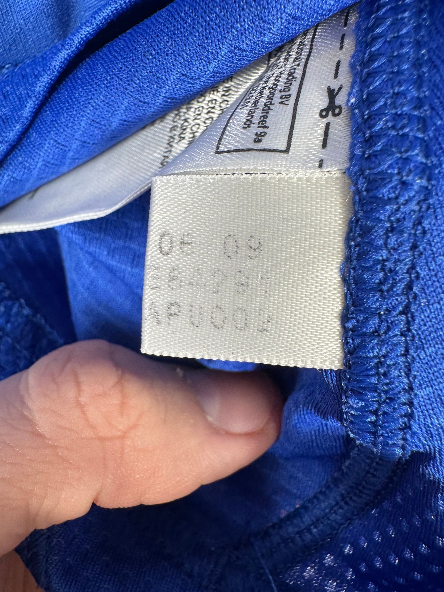 Étiquette d'authenticité avec code Adidas E84291 prouvant l'originalité du maillot