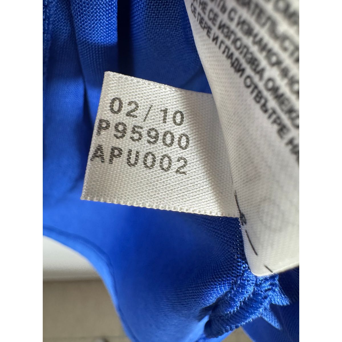 Étiquette d'authenticité avec code Adidas P95900 prouvant l'originalité du maillot