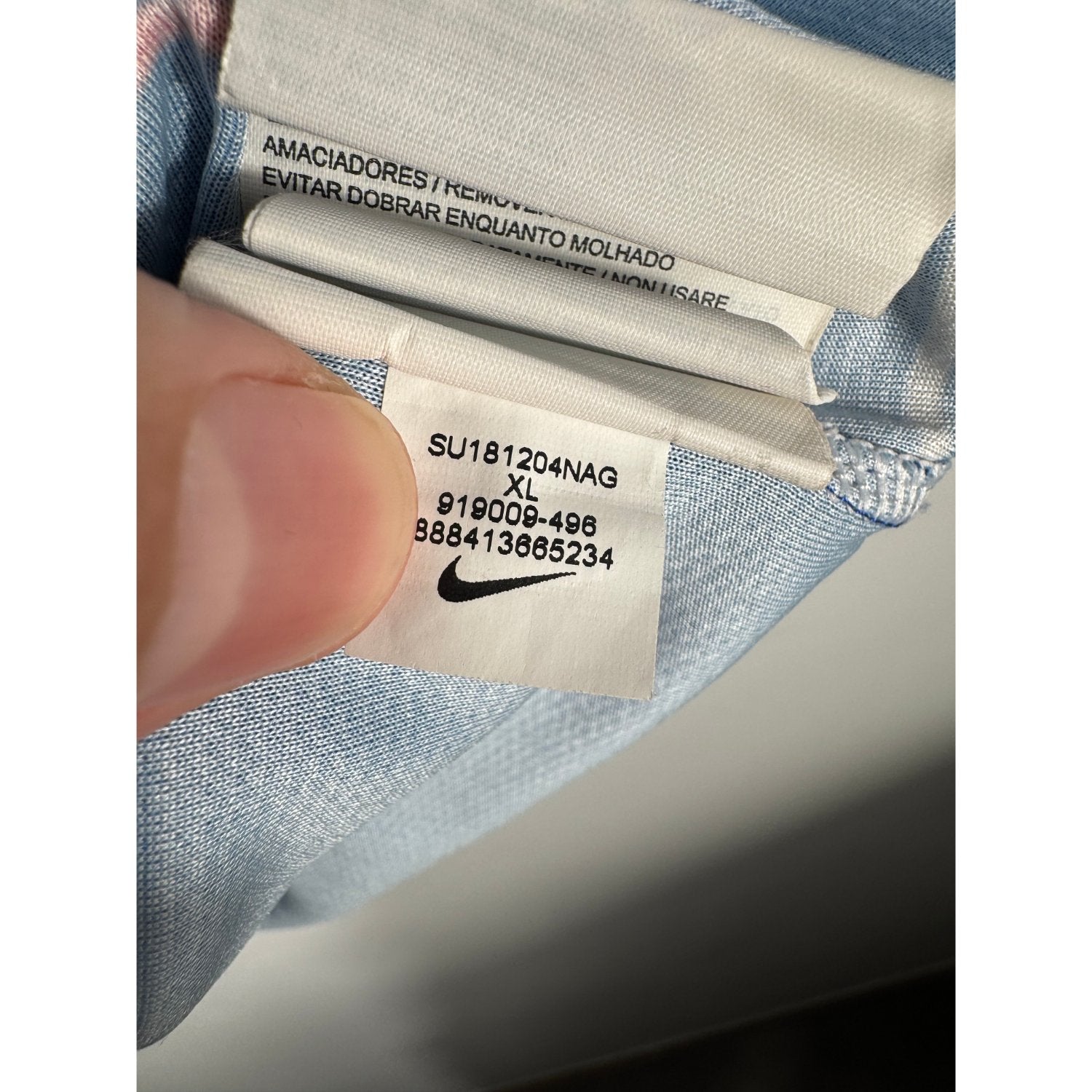 Étiquette d'authenticité avec code Nike 919009-496 prouvant l'originalité du maillot