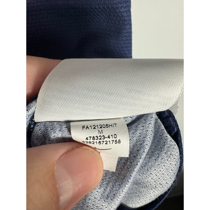 Étiquette d'authenticité avec code Nike 478323-410 prouvant l'originalité du maillot