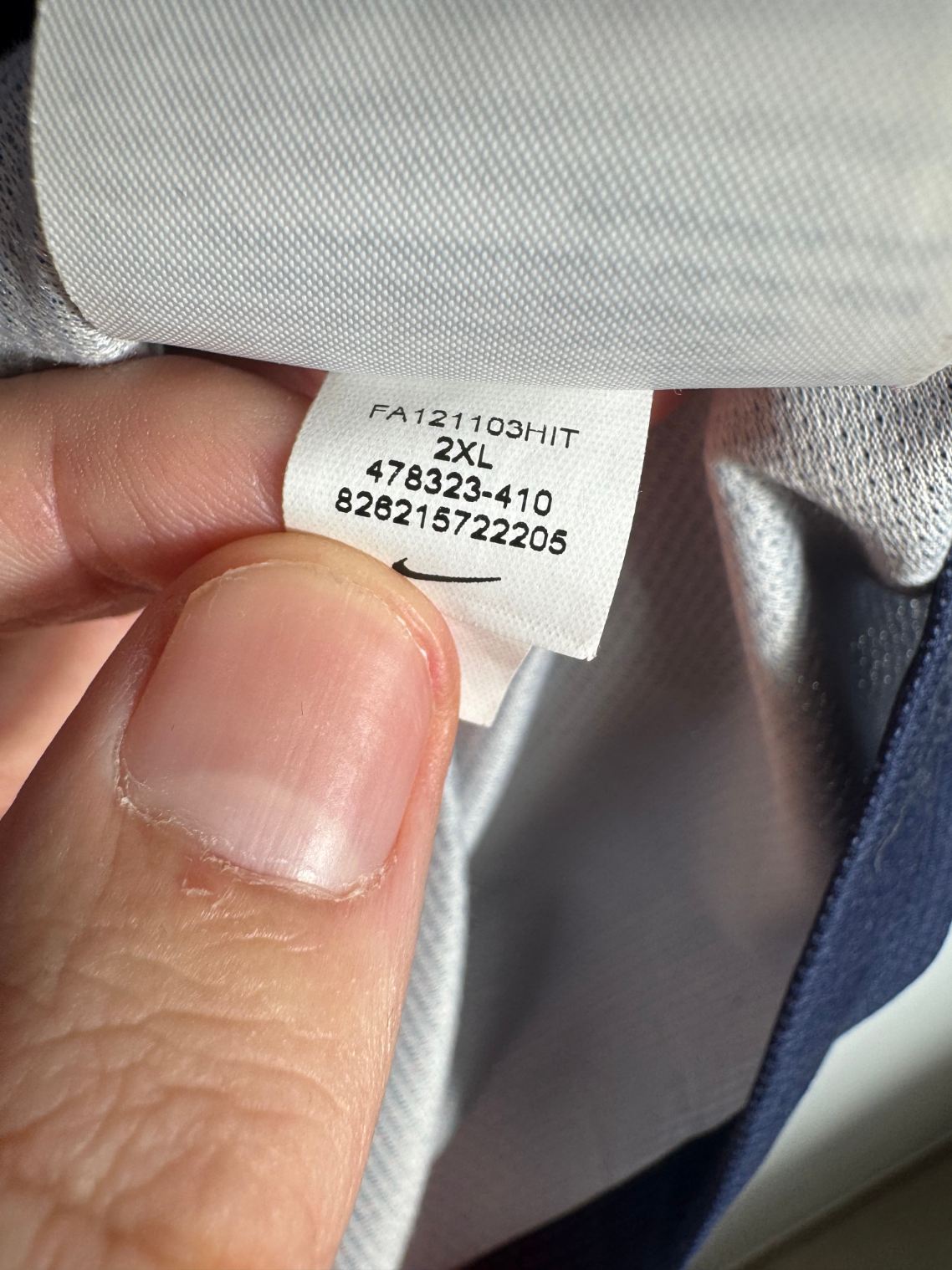 Étiquette d'authenticité avec code Nike 478323-410 prouvant l'originalité du maillot