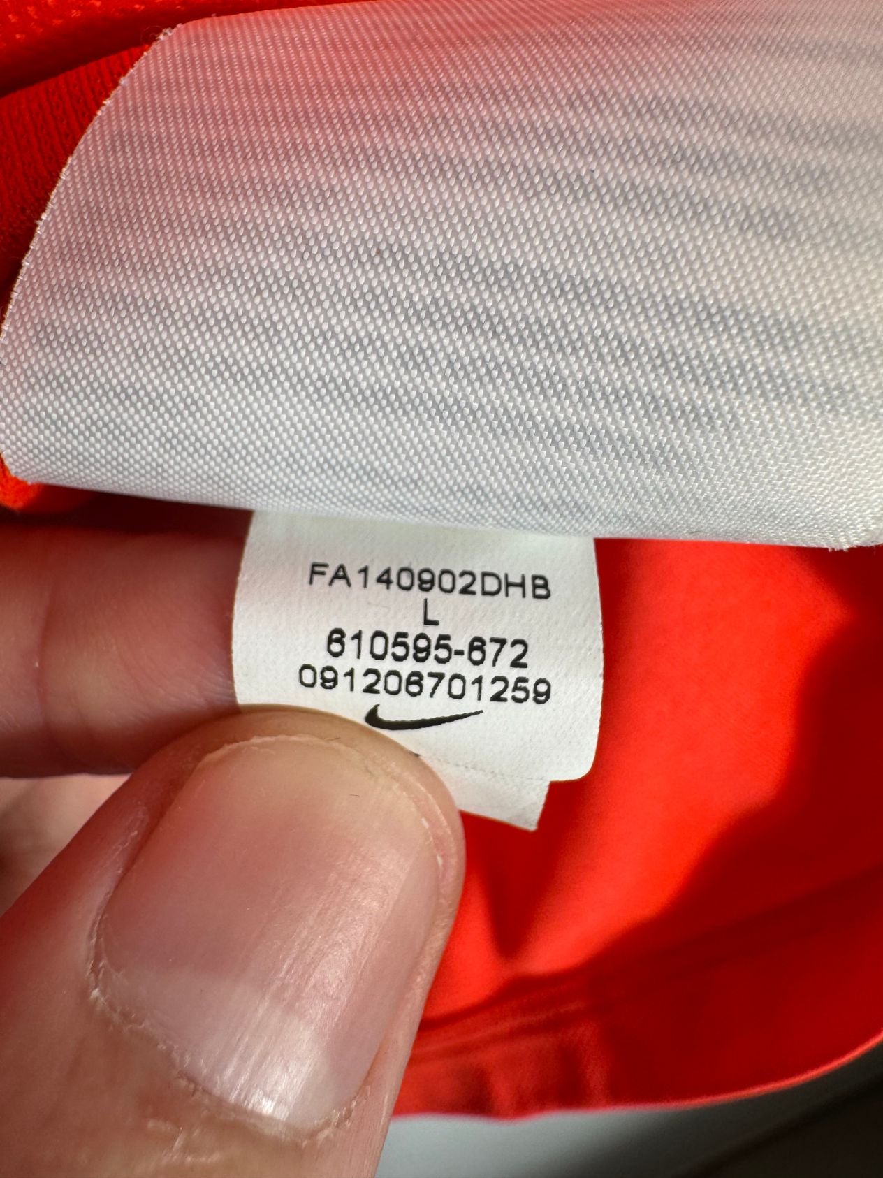 Étiquette d'authenticité avec code Nike 610595-672 prouvant l'originalité du maillot