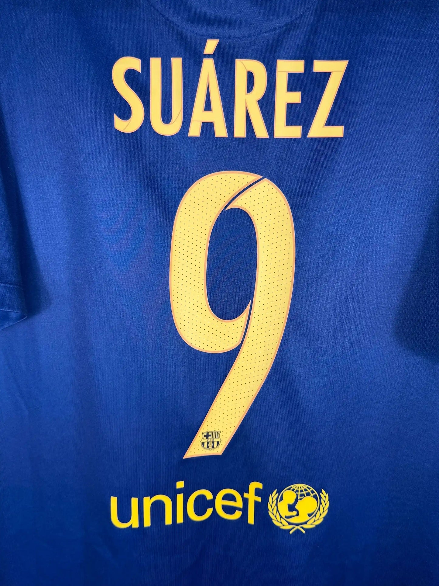 Détail flocage Suárez N°9 sur maillot FC Barcelone domicile 2015-2016 apex statistique Soulier d'Or Européen