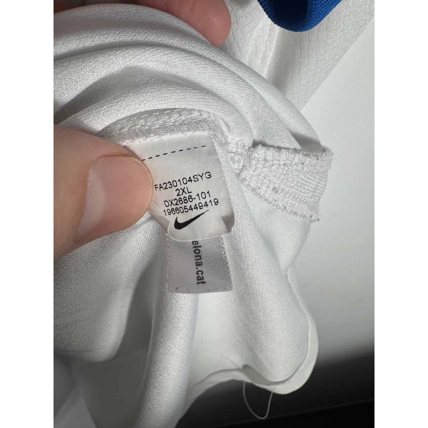 Étiquette d'authenticité avec code Nike DX2686-101 prouvant l'originalité du maillot