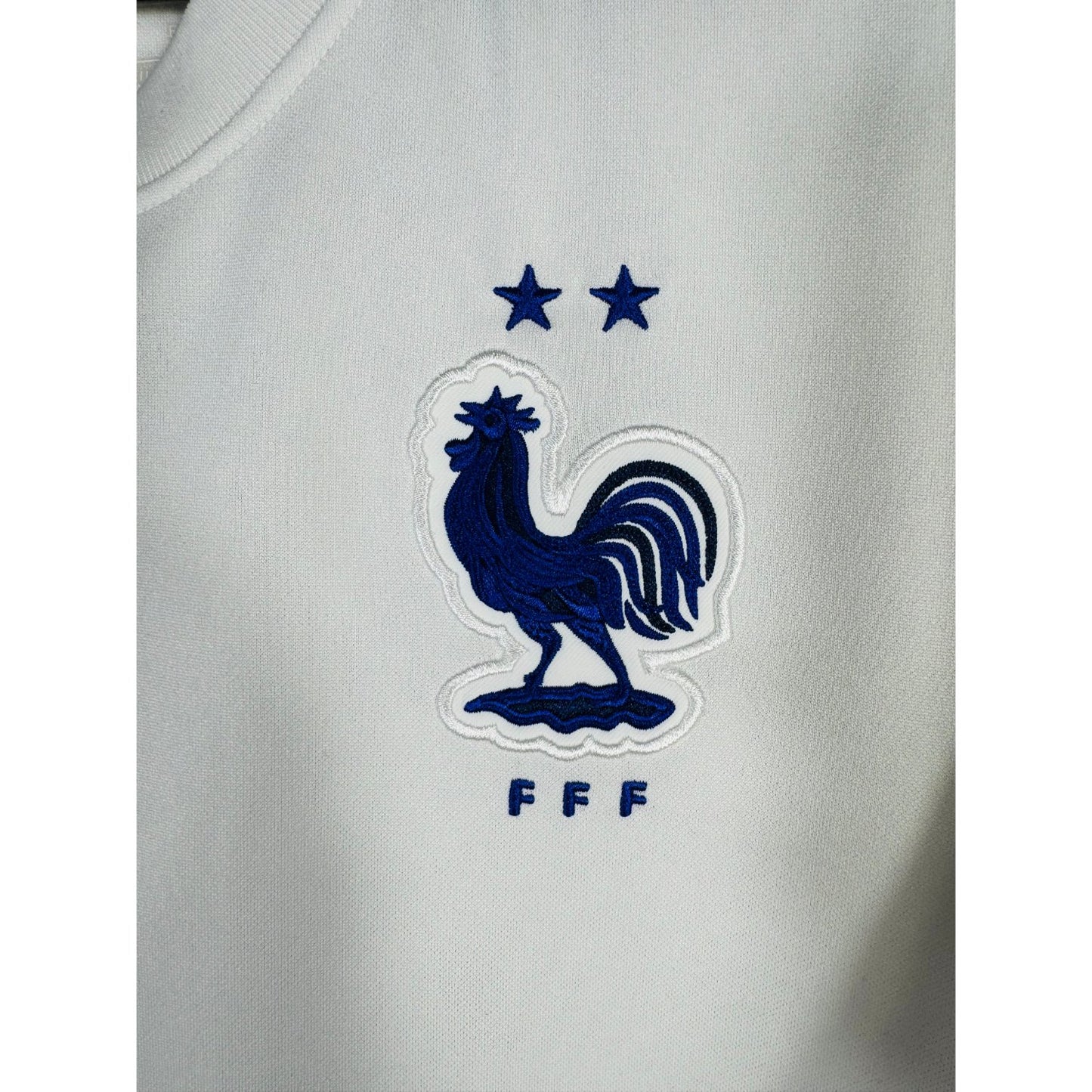 Détail de l'écusson de la France et du logo Nike
