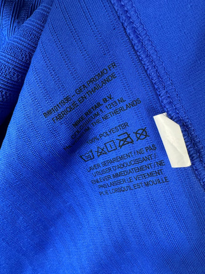 Marquage intérieur du maillot France 2024 indiquant GFA PROMO FR, preuve d'une pièce de dotation fédérale et non de boutique