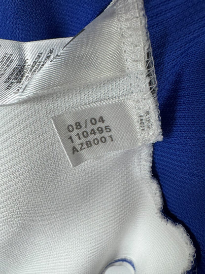 Étiquette intérieure adidas avec le code 110495 et la date 08/04 du maillot Grèce 2004