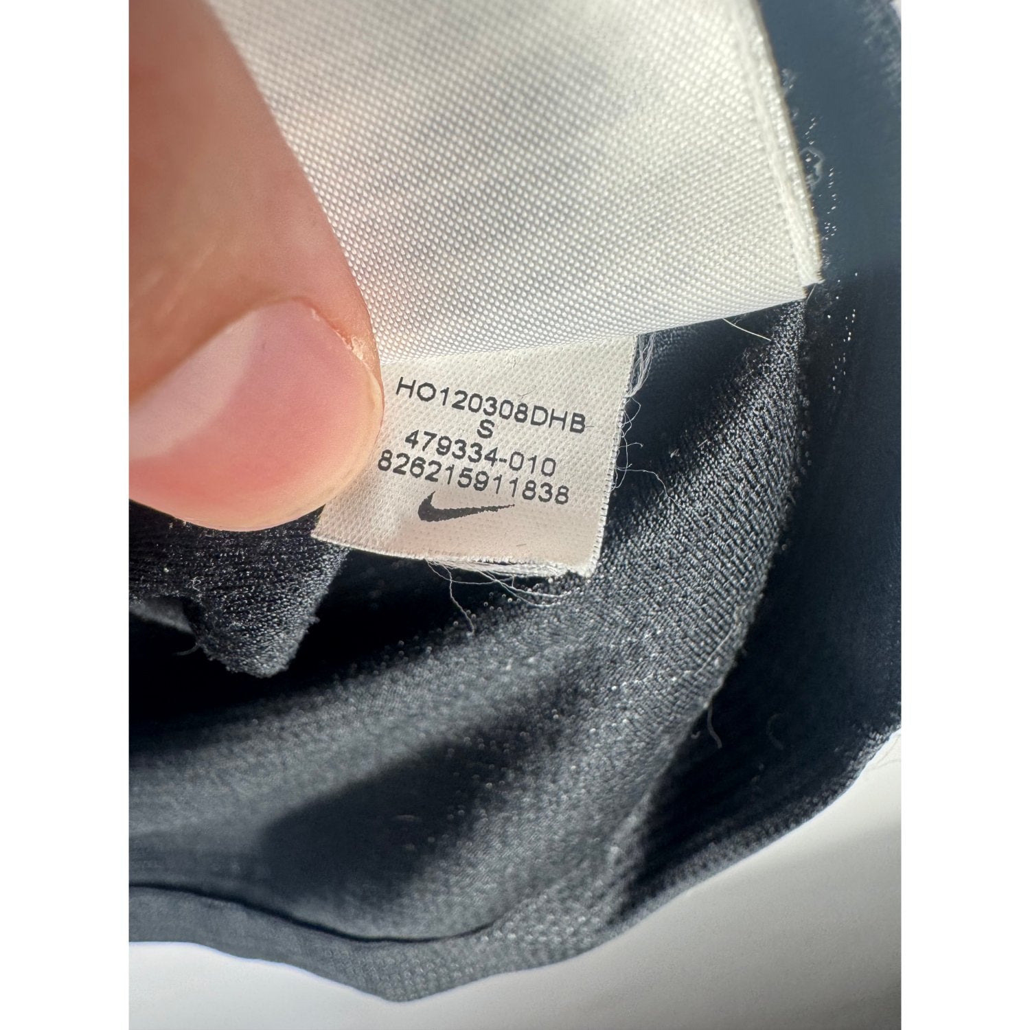 Étiquette d'authenticité avec code Nike 479334-010 prouvant l'originalité du maillot