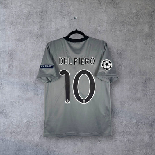 Dos du maillot Juventus gris argenté avec flocage noir DEL PIERO 10 et patchs LDC.