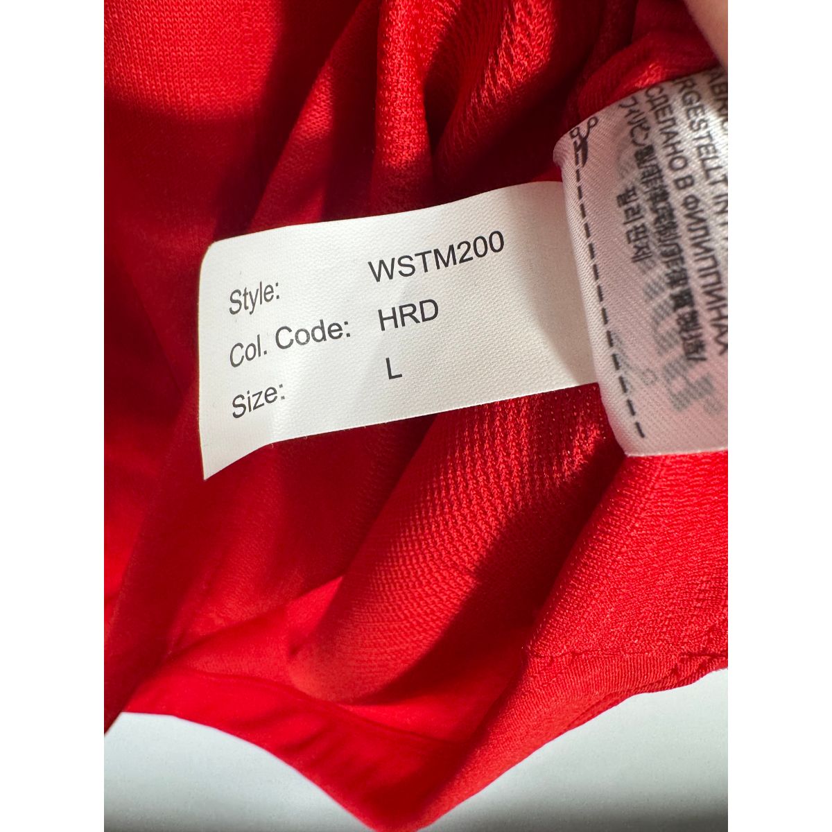 Étiquette d'authenticité avec code Warrior WSTM200 prouvant l'originalité du maillot