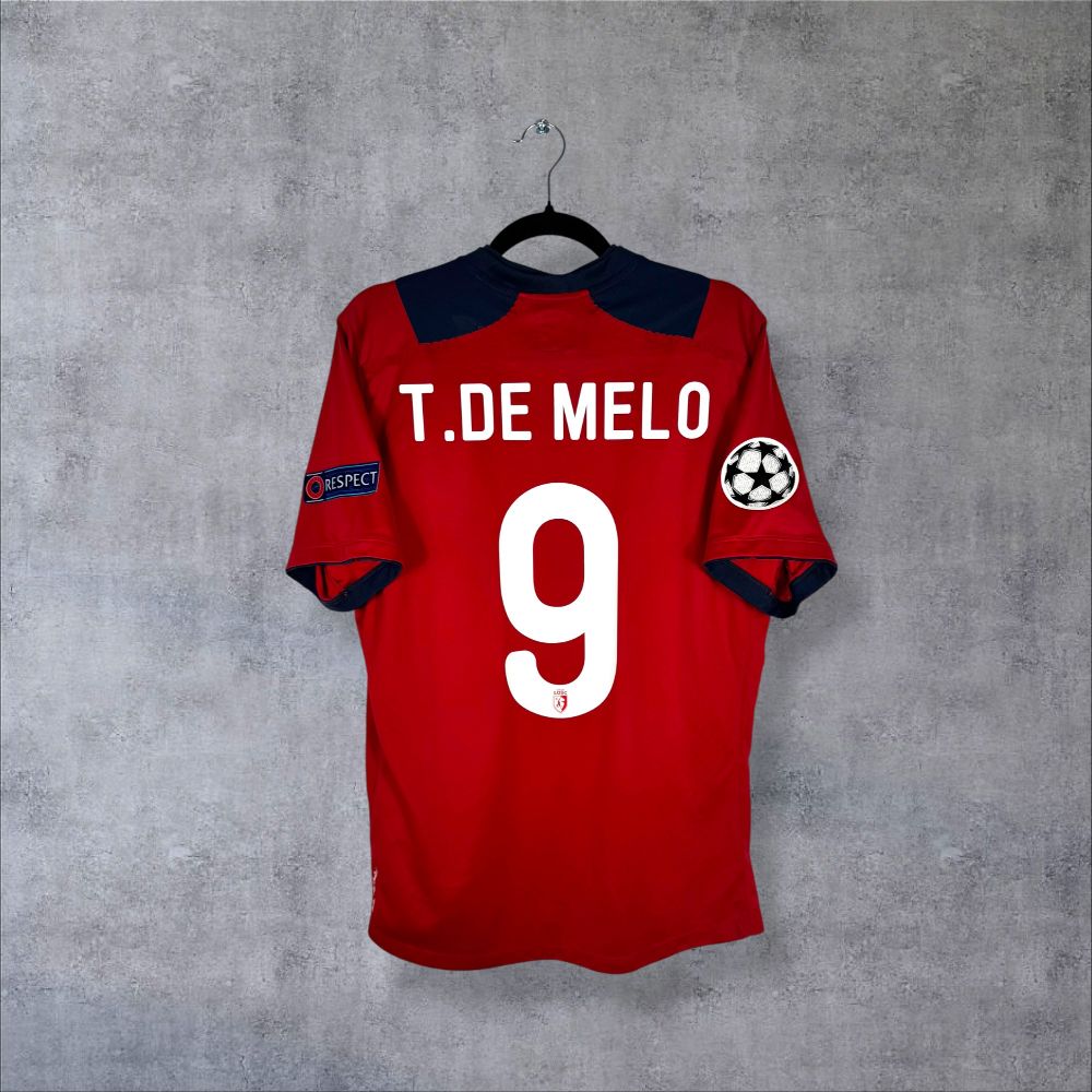 Dos du maillot LOSC Lille 2012-2013 domicile rouge bordeaux avec flocage T.De Melo N°9 et patch UEFA Champions League authentique homme de Copenhague