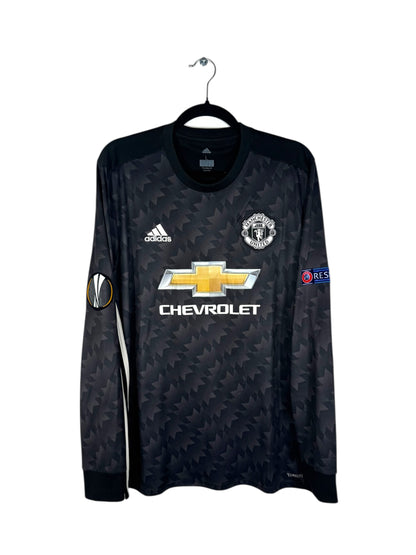Vue de face du maillot Manchester United Extérieur 2017/18 noir à motifs graphiques gris.