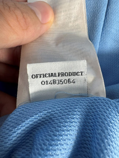 Étiquette Official Product numérotée 014835064, maillot domicile Manchester City 2012-2013 Umbro