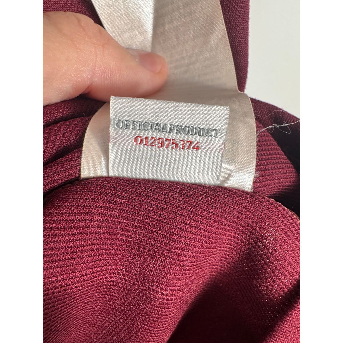 Étiquette d'authenticité Umbro prouvant l'originalité du maillot