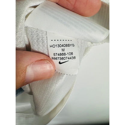 Étiquette d'authenticité avec code Nike 574868-106 prouvant l'originalité du maillot