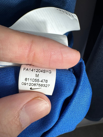 Étiquette d'authenticité avec code Nike 611055-476 prouvant l'originalité du maillot