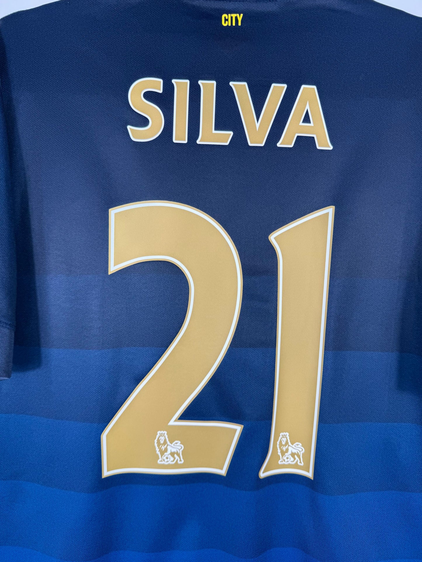 Détail de la typographie du flocage sur le numéro 21 de David Silva