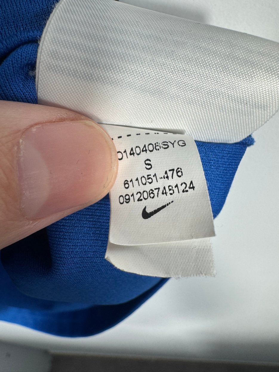 Étiquette d'authenticité avec code Nike 611051-476 prouvant l'originalité du maillot