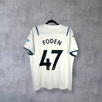 Dos du maillot Manchester City extérieur 2021-2022 Puma blanc cassé, flocage Foden 47 et sponsor de manche Nexen Tire