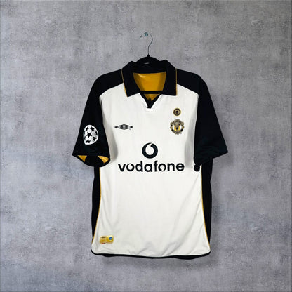 Face du maillot Manchester United 2001-2002 extérieur blanc noir et or avec sponsor Vodafone